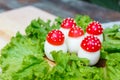 Funny food - boiled egg, cover with a tomato with mayonnaise points