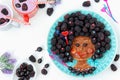 Funny food idea for kids edible girl, face from pancake, gooseberry and blackberry, food art