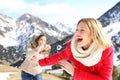 Funny friends joking throwing snowballs Royalty Free Stock Photo