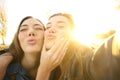 Funny friends taking a selfie at sunset