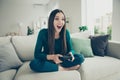 Funny funky emotional charming pretty delightful overjoyed nice glad she her lady using gamepad for playing videogame