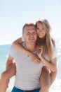Funny games happy couple in love on the beach Royalty Free Stock Photo