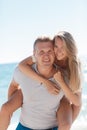 Funny games happy couple in love on the beach Royalty Free Stock Photo