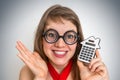 Funny geek or nerd school woman with calculator