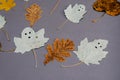 Funny ghosts drawn on the leaves of a poplar tree