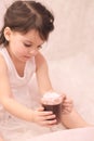 funny girl in ballerina tutu with a glass of hot drink in her hands