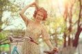 Funny girl on bicycle in spring park Royalty Free Stock Photo