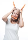 Funny girl bunny ears with a carrot. Concept of healthy food Royalty Free Stock Photo