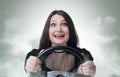 Funny girl with car wheel and smoke