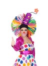Funny girl clown with a big colorful wig saying Ok