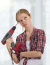 Funny girl with a drill drills head Royalty Free Stock Photo