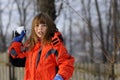 Funny girl fighting with snowballs