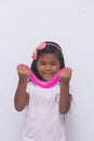 Funny girl holdin a glitter slime, photo with white background.