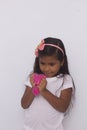 Funny girl holdin a glitter slime, photo with white background.