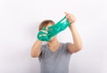 Girl holding a slime in front of her face and looking through its hole. Focused on the eye Royalty Free Stock Photo