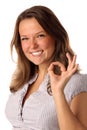 Funny girl indicating OK sign on white background