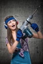 Funny girl with a jackhammer Royalty Free Stock Photo