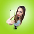 Funny girl make a duck face, and take a self portrait with her s Royalty Free Stock Photo