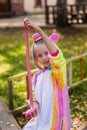 Funny girl playing with pink slime