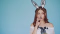 Funny girl - a rabbit with creative ears, chews parsley and looks around