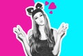 Funny girl represents a small cat or mouse. Woman with a bright makeup hairstyle and night dress mouse ears having fun