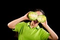 Funny girl with sliced cabbage on eyes