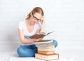 Funny girl student preparing homework, preparing for exam readi Royalty Free Stock Photo