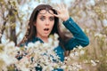 Funny Girl Surrounded by Blossoming Trees Afraid of Allergies