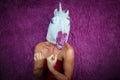 Funny girl unicorn ready to fight and clenches fists. Freaky young woman Royalty Free Stock Photo