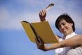 Funny girl with a yellow notebook Royalty Free Stock Photo