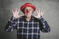 Funny grandfather with hat and clown nose