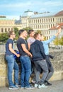 Funny group of guys tourists taking selfie on Charles bridge, Prague, Czech Republic