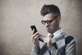 Funny guy having troubles with his smartphone Royalty Free Stock Photo