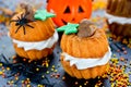 Funny Halloween cupcakes shaped pumpkin with cream, creative and Royalty Free Stock Photo