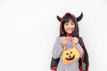 Funny Halloween Kid Concept, little cute girl with costume Halloween ghost scary he holding orange pumpkin ghost on hand, on white Royalty Free Stock Photo