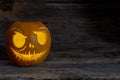 Funny Halloween pumpkin face with glowing candle.