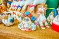 Funny ceramic toys in traditional Ukrainian style on National Sorochynsky Fair in Sorochyntsi, Ukraine