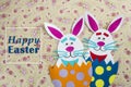 Funny handmade cartoon rabbits placed inside eggs with text