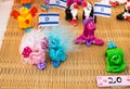 Funny handmade souvenirs holding israeli flag sale at handicraft market