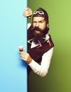 Funny handsome bearded pilot and glasses on blue green studio background Royalty Free Stock Photo