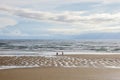 Two people doing funny handstand on the beach. Sandy beach and two people. Royalty Free Stock Photo