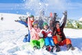 Funny happy friends with snowboards throwing snow Royalty Free Stock Photo