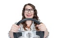 Funny happy girl in glasses and eyes in a heap with car wheel, isolated on white background, auto concept Royalty Free Stock Photo