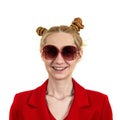 Funny, happy, laughing young girl student, with an interesting hairstyle and sunglasses, openly laughing and looking at