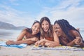 Funny, happy and portrait with friends on beach for travel, diversity and summer break with blue sky mockup. Sunbathing