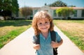 Funny happy school boy face. Back to school. Cute kid with backpack running and going to school. Royalty Free Stock Photo