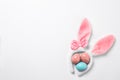 Funny headband with Easter bunny ears and dyed eggs white background Royalty Free Stock Photo