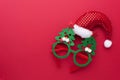 Funny Headband with Santa Claus Hat and Glasses With Green Christmas Trees.