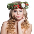 Funny healthy young woman with party makeup, long blonde curly hairdo and Christmas decor isolated on white background. Christmas