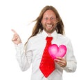 Funny hippie man holding a love heart and pointing